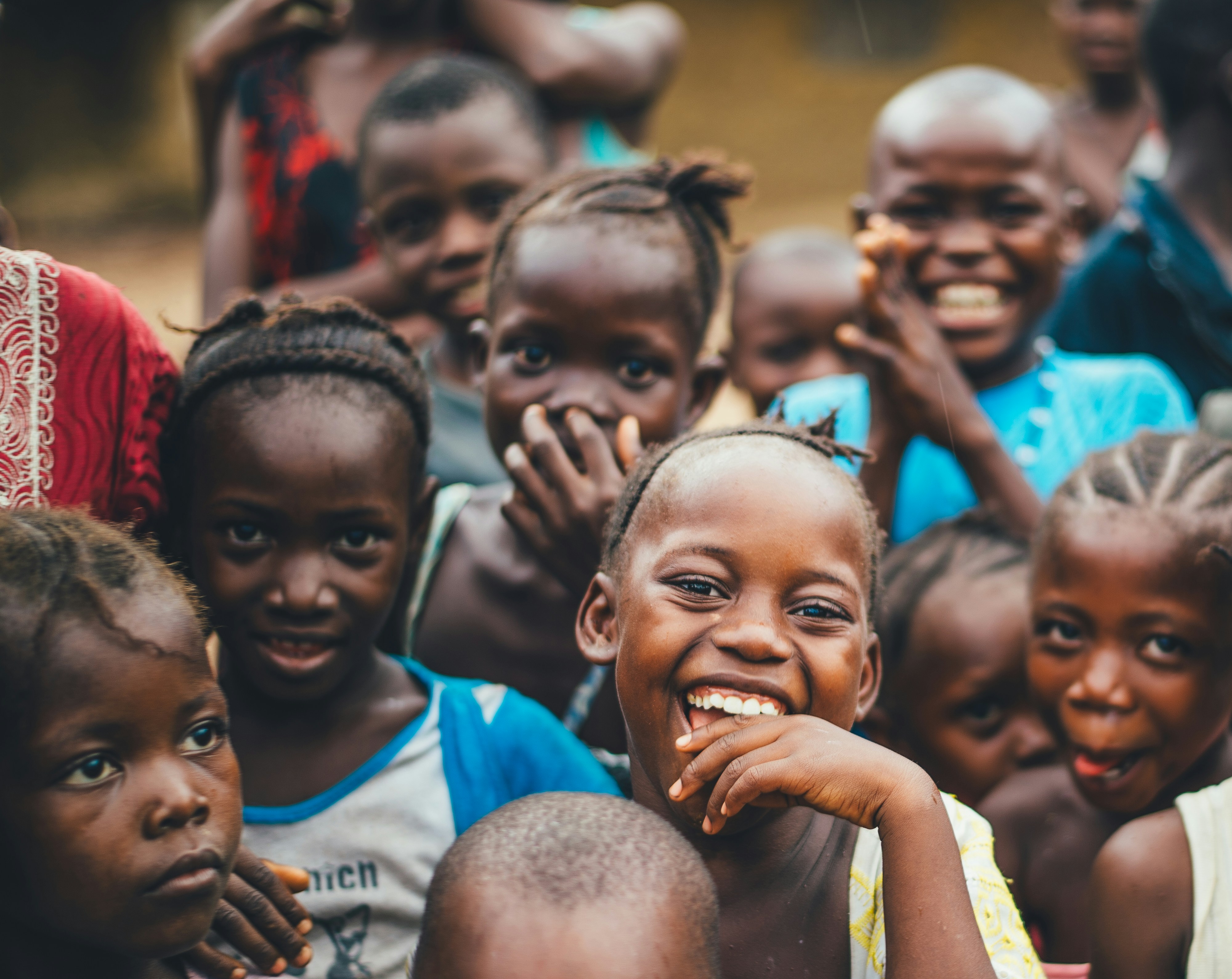 Children smiling together in community
